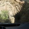 One of the two rough cut tunnels on the one-lane dirt road