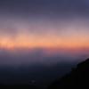 Early sunlight through clouds and mist