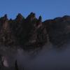 Mist hangs around the high peaks of Rocky Mountain in the early morning