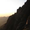 The sun just starting to illuminate the peaks