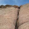 Looking up at Mark on top of the first pitch of Ed's Crack