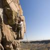 Sean works the crux of Henry Spies the Line (5.10a)