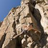 Mark takes a go at Unknown O (5.11d)
