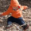 Gabe playing with climbing gear
