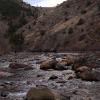 Mark and Dylan workng across the Poudre River