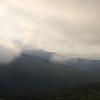 The clouds break up, but still pour into our little canyon