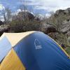 Tent with The Heap formation behind it