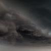 The wall cloud spins above me
