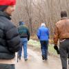 The family hiking through the woods