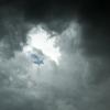 Looking up at blue sky above