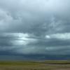 The funnel clouds below the wall cloud came and went quickly