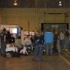 The class hangs out in the presentation area of the warehouse