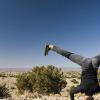 Ann practicing a headstand in the desert