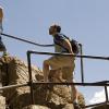 TJ and Mark climb the rocks and steps to the high lake