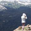 A cold girl on vacation enjoys the views
