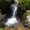 A pretty waterfall on the side of the trail