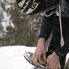 Mark adjusts his gaitors in the snow
