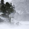 Wind and snow blowing across the frozen lake