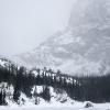 Snow and wind blowing down from the high peaks