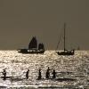 A Chinese Junk sailing by in the evening