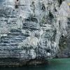 Climbers working their way around the rock