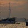 Kids playing on sailboats 