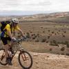 Mark rides on the edge of the Mesa