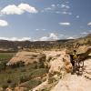 Mark hikes a bike up a narrow section of trail