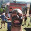 Mark's camo face paint (and an interesting alignment with the banner behind!)