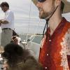 Mark and the boat mascott: a pocket pomeranian we called "Mr. Muggles"