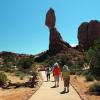 The family hikes in to see Balanced Rock